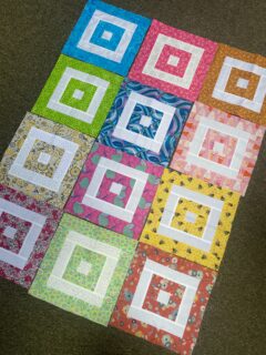 For the past year I have been participating in a quilting bee block swop at the patchwork group that I belong to. Every month I have had to make a block for someone and every month someone has made a block for me. These are the blocks that have been made for me. A lovely selection of bright colours. I am going to stitch these into a quilt for charity. My initial thought is to add some white sashing between the blocks. What would you do?
#charityquilt #charityquilts